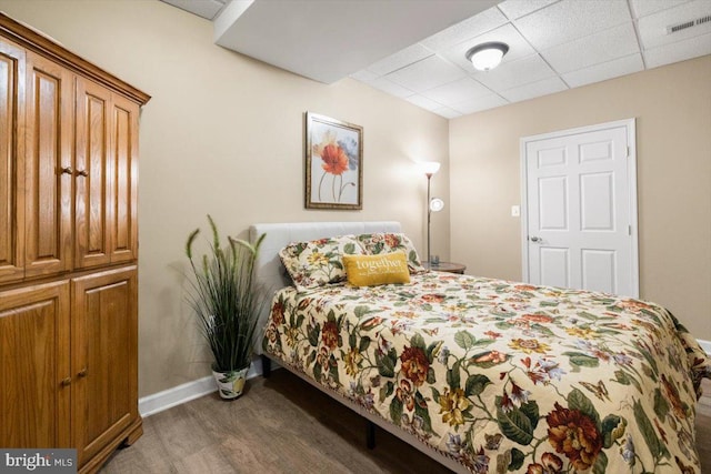7135 Hills Ln, Warrenton, VA 20187 - bedroom with wood finished floors, baseboards, and a paneled ceiling