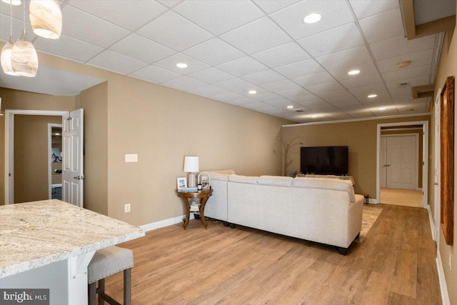 7135 Hills Ln, Warrenton, VA 20187 - living area with light wood-type flooring, baseboards, recessed lighting, and a paneled ceiling