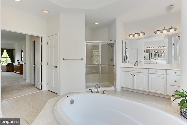 full bath featuring a garden tub, a stall shower, recessed lighting, and vanity