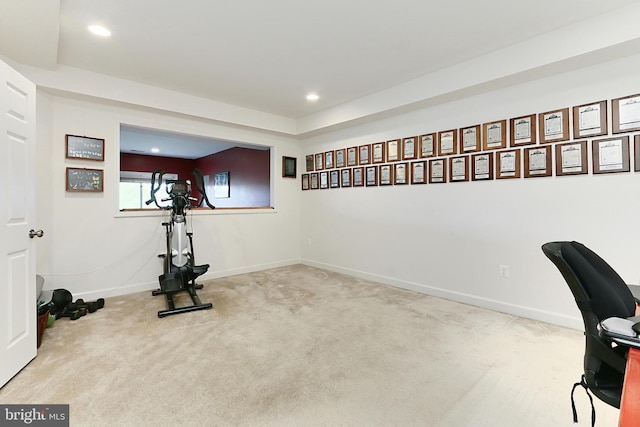 exercise area featuring recessed lighting, carpet, and baseboards