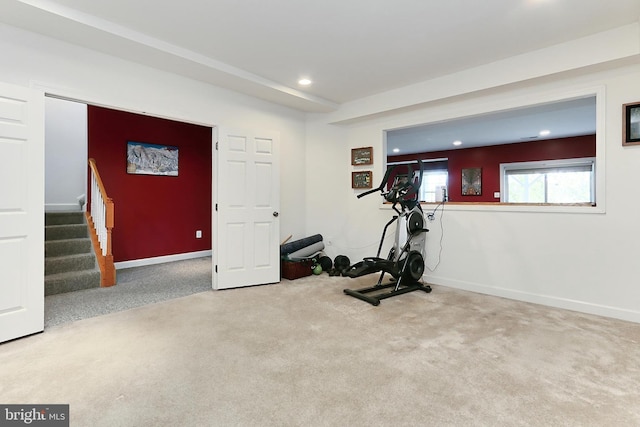 exercise area featuring baseboards, recessed lighting, and carpet floors