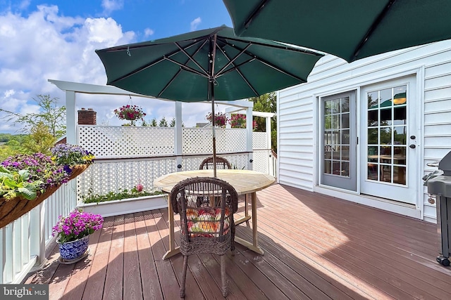 wooden deck with outdoor dining area