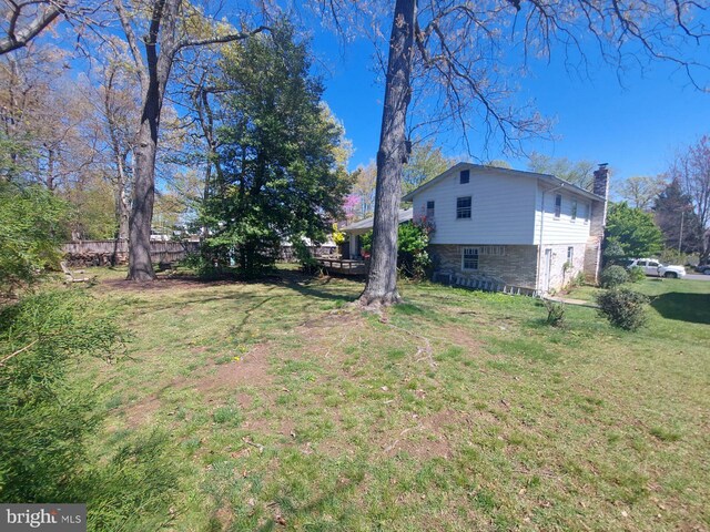 view of yard with a wooden deck