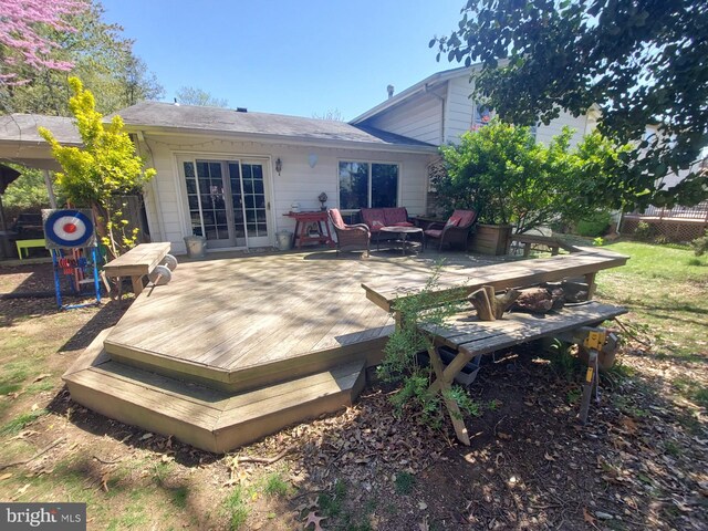 back of house with outdoor lounge area, fence, and a deck