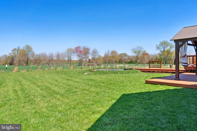 view of yard featuring a gazebo and a deck