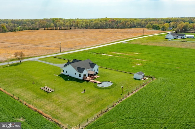 birds eye view of property with a rural view
