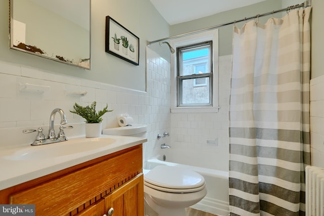 full bath featuring vanity, shower / bathtub combination with curtain, tile walls, radiator, and toilet
