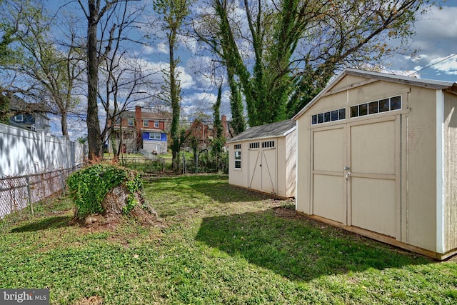 view of shed with fence