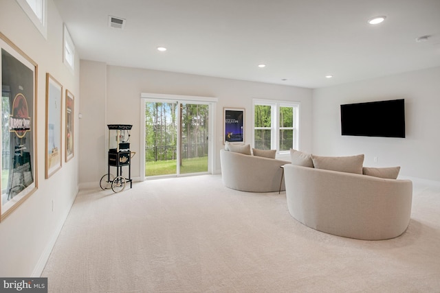 living room with recessed lighting, baseboards, visible vents, and carpet