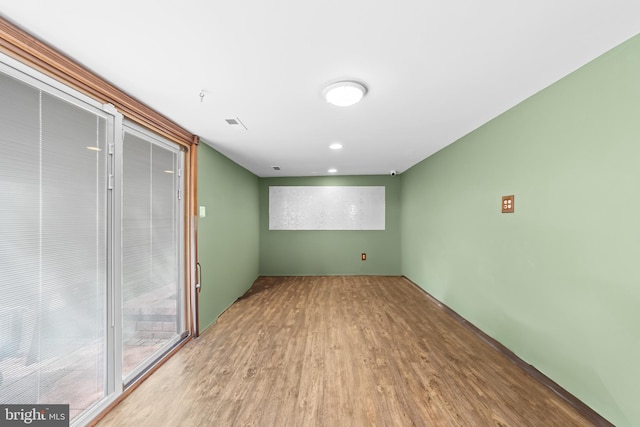 spare room featuring wood finished floors