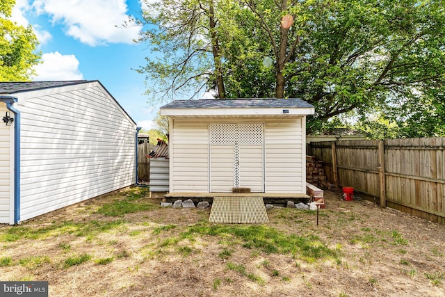 view of shed with a fenced backyard