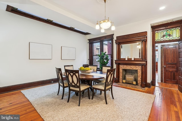 1231 Girard St NW, Washington, DC 20009 - dining area featuring baseboards, a chandelier, recessed lighting, a fireplace with flush hearth, and hardwood / wood-style flooring