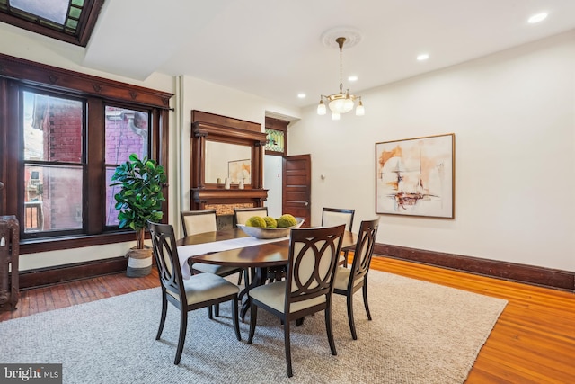 1231 Girard St NW, Washington, DC 20009 - dining area featuring recessed lighting, wood-type flooring, baseboards, and an inviting chandelier