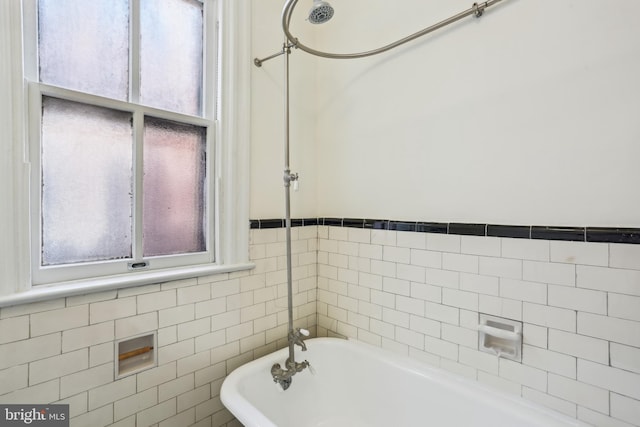 1231 Girard St NW, Washington, DC 20009 - bathroom with a tub, tile walls, and a healthy amount of sunlight