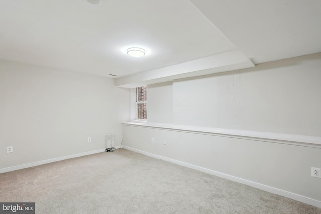 1231 Girard St NW, Washington, DC 20009 - finished below grade area featuring baseboards, heating unit, and carpet