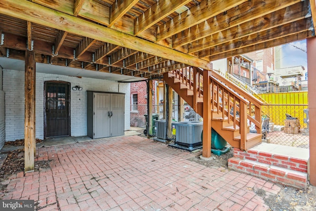 1231 Girard St NW, Washington, DC 20009 - view of patio with central AC, fence, and stairway