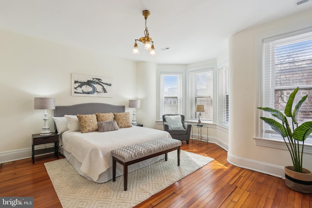 1231 Girard St NW, Washington, DC 20009 - bedroom featuring wood-type flooring, baseboards, and multiple windows