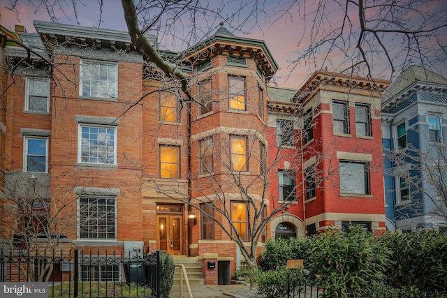 1231 Girard St NW, Washington, DC 20009 - view of front of home with brick siding and a fenced front yard