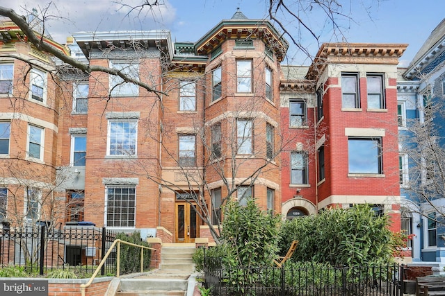 1231 Girard St NW, Washington, DC 20009 - multi unit property featuring a fenced front yard and brick siding