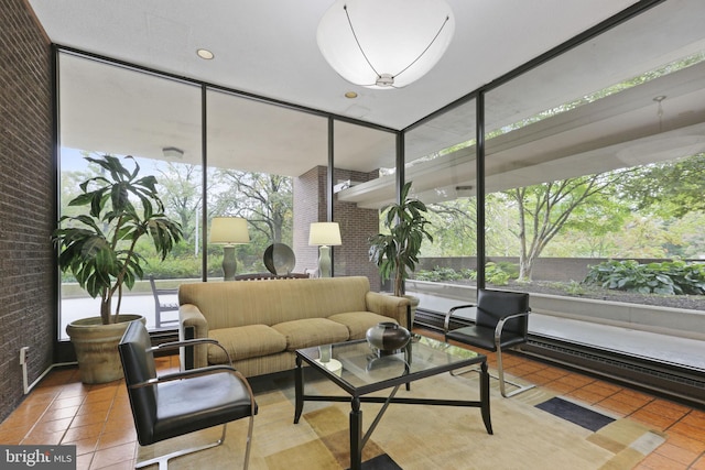 lobby with brick wall and floor to ceiling windows