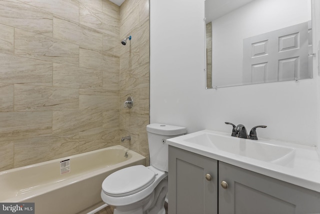 bathroom with vanity, toilet, and tub / shower combination