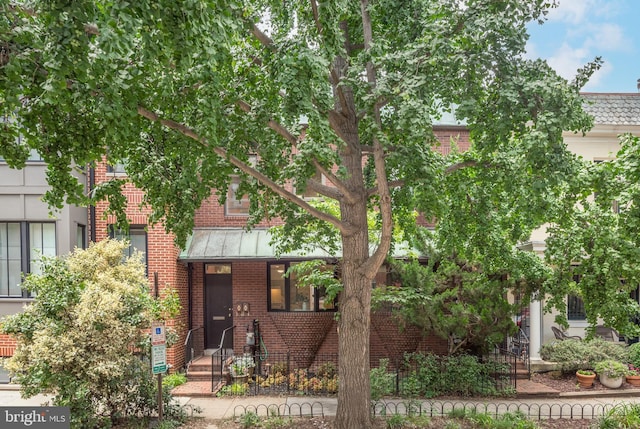1773 Swann St NW, Washington, DC 20009 - view of front of home featuring brick siding and a standing seam roof