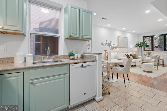 1773 Swann St NW, Washington, DC 20009 - kitchen featuring dishwasher, open floor plan, recessed lighting, and light tile patterned floors