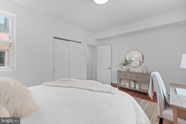 1773 Swann St NW, Washington, DC 20009 - bedroom featuring a closet and tile patterned floors