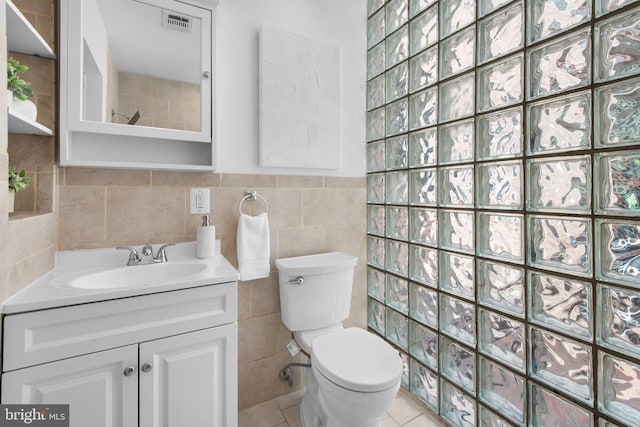 1773 Swann St NW, Washington, DC 20009 - bathroom featuring vanity, tile walls, a tile shower, and tile patterned floors