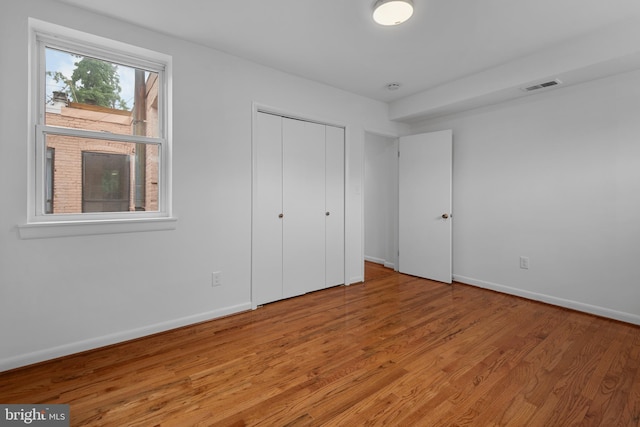 1773 Swann St NW, Washington, DC 20009 - unfurnished bedroom featuring light wood-style floors and a closet