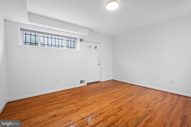 1773 Swann St NW, Washington, DC 20009 - spare room featuring wood finished floors and baseboards