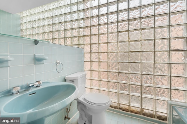 1773 Swann St NW, Washington, DC 20009 - bathroom featuring tile walls and tile patterned flooring