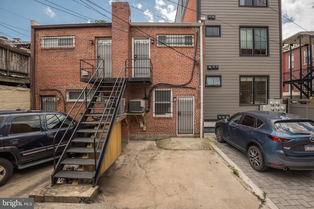 1773 Swann St NW, Washington, DC 20009 - rear view of house featuring brick siding and stairs