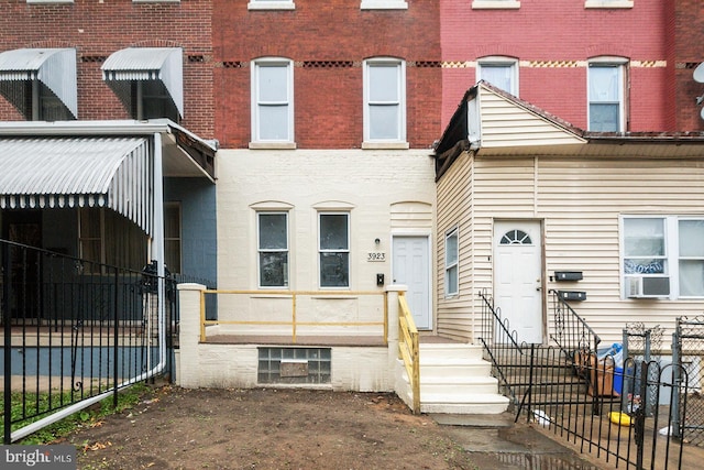 3923 Brown St, Philadelphia, PA 19104 - view of front of home featuring brick siding, fence, and cooling unit