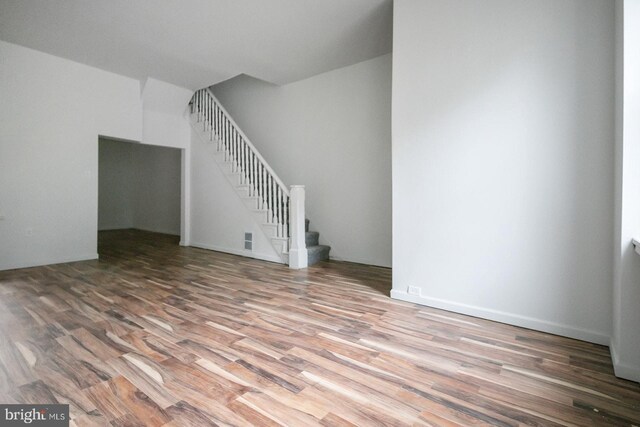 3923 Brown St, Philadelphia, PA 19104 - unfurnished living room featuring stairway and wood finished floors