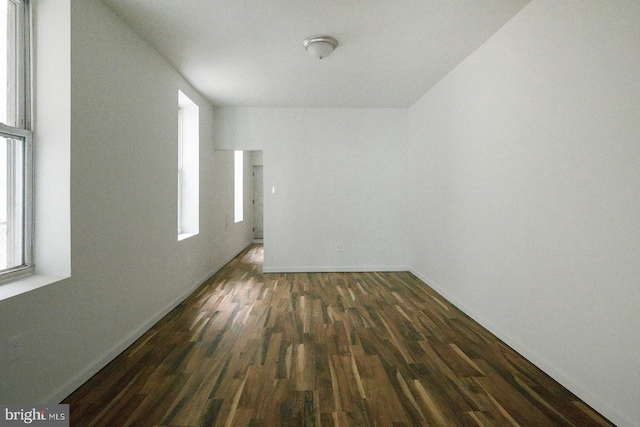 3923 Brown St, Philadelphia, PA 19104 - empty room featuring dark wood-style flooring and a wealth of natural light