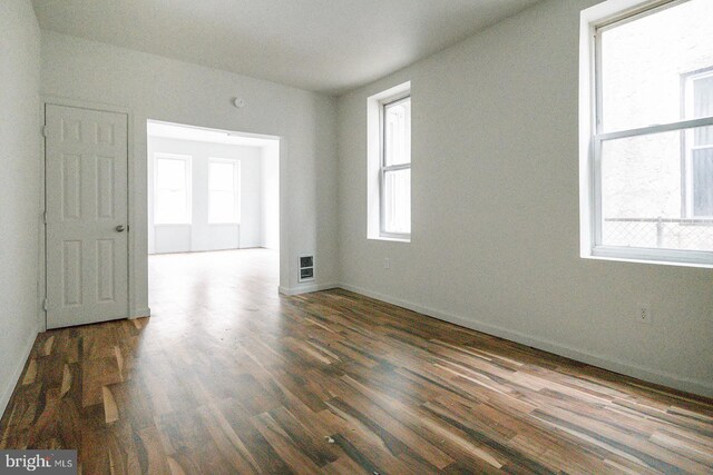 3923 Brown St, Philadelphia, PA 19104 - empty room featuring visible vents, baseboards, and wood finished floors