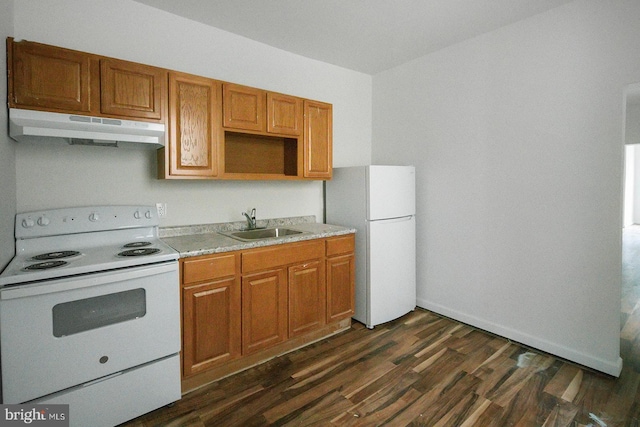 3923 Brown St, Philadelphia, PA 19104 - kitchen featuring dark wood-style flooring, white appliances, light countertops, under cabinet range hood, and a sink
