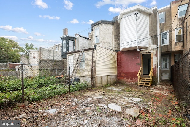 3923 Brown St, Philadelphia, PA 19104 - back of house featuring entry steps and fence