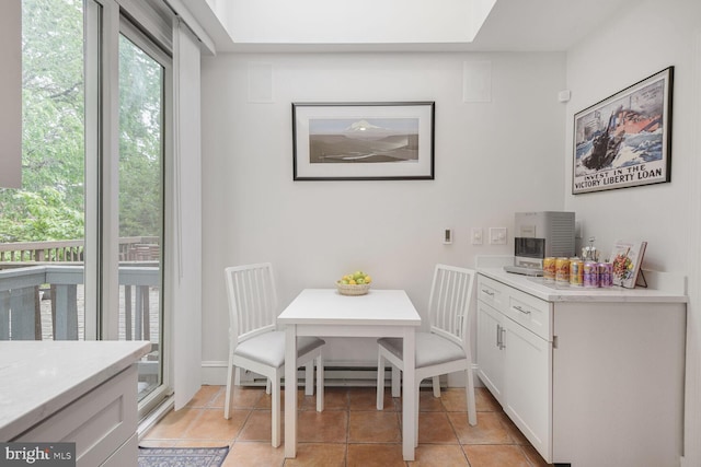 dining area featuring light tile patterned floors
