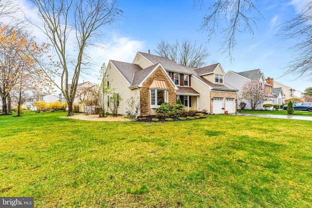 view of front of home with driveway, a front yard, and a residential view