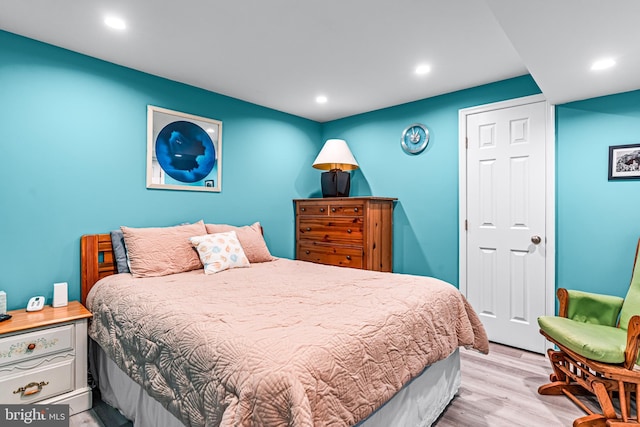 bedroom featuring recessed lighting and wood finished floors