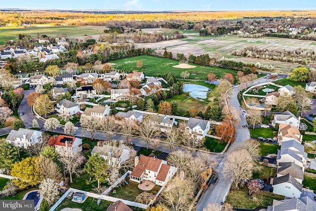aerial view with golf course view and a residential view