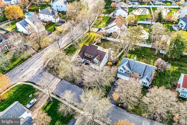 birds eye view of property with a residential view