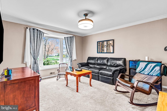 living room featuring carpet, baseboards, and crown molding