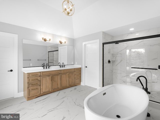 full bath featuring marble finish floor, a sink, a marble finish shower, a freestanding bath, and double vanity