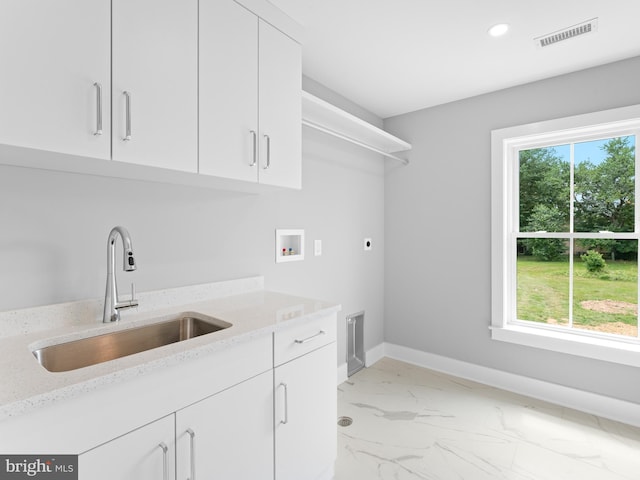 laundry room featuring visible vents, a sink, cabinet space, electric dryer hookup, and hookup for a washing machine