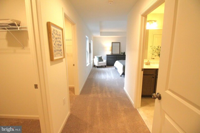 1609 Schwinn St, Middletown, DE 19709 - hall featuring baseboards, light carpet, and a sink