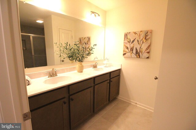1609 Schwinn St, Middletown, DE 19709 - full bathroom featuring tile patterned flooring, a sink, double vanity, and a stall shower