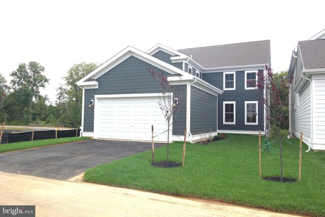 1609 Schwinn St, Middletown, DE 19709 - view of front facade featuring an attached garage, aphalt driveway, and a front yard